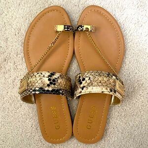 Guess snake print flats with gold chain and details.